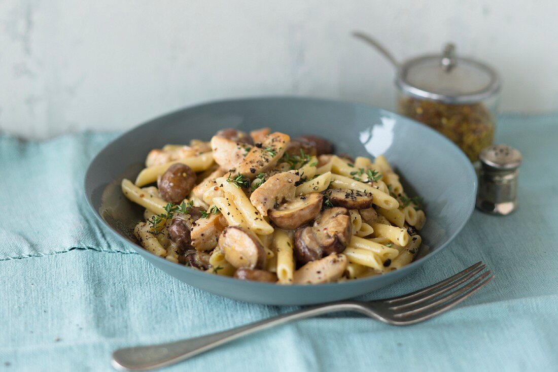 Penne with a chicken and mustard sauce in a bowl