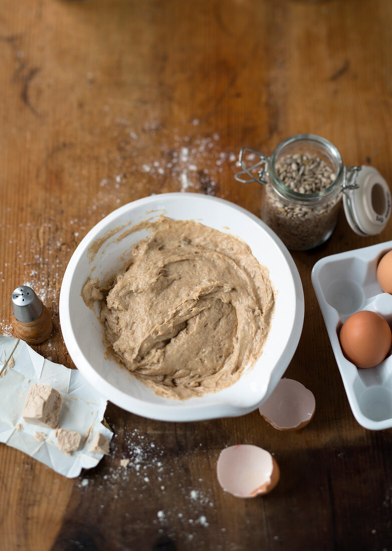 Sour dough with red mousse in bowl for preparing waffles