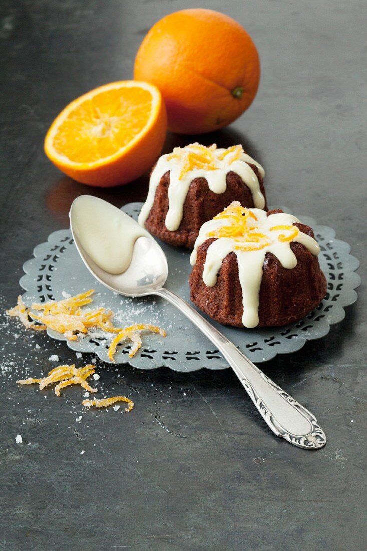 Mini orange Bundt cakes with white chocolate glaze and orange zest