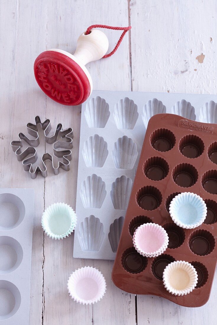 A biscuit cutter, silicon baking moulds and paper cases