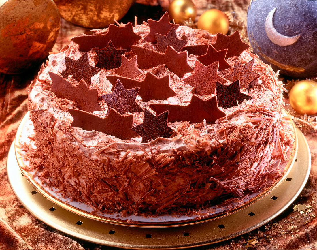Chocolate cake decorated with chocolate stars and flakes