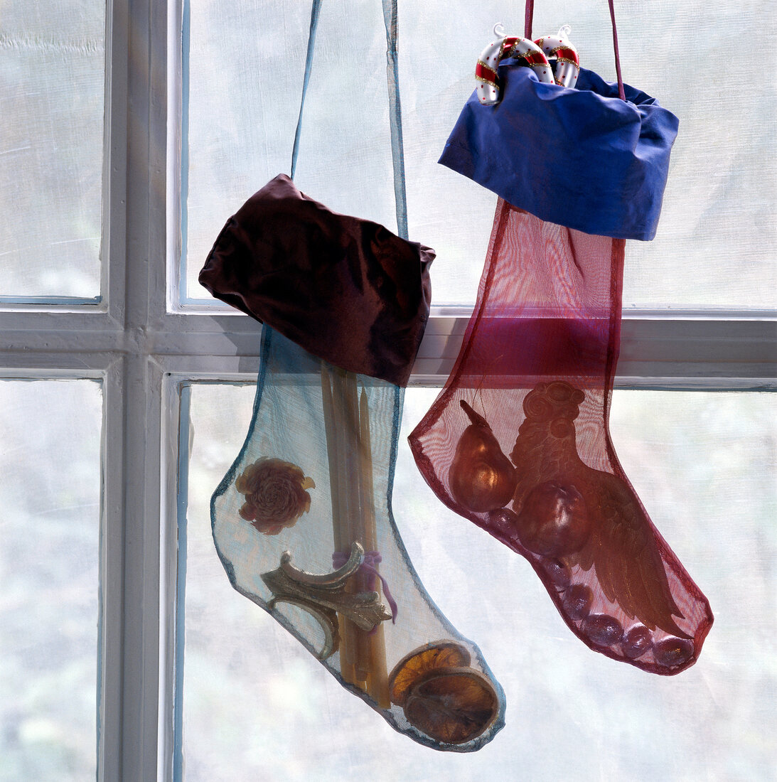 Christmas stocking with decorations hanging on window
