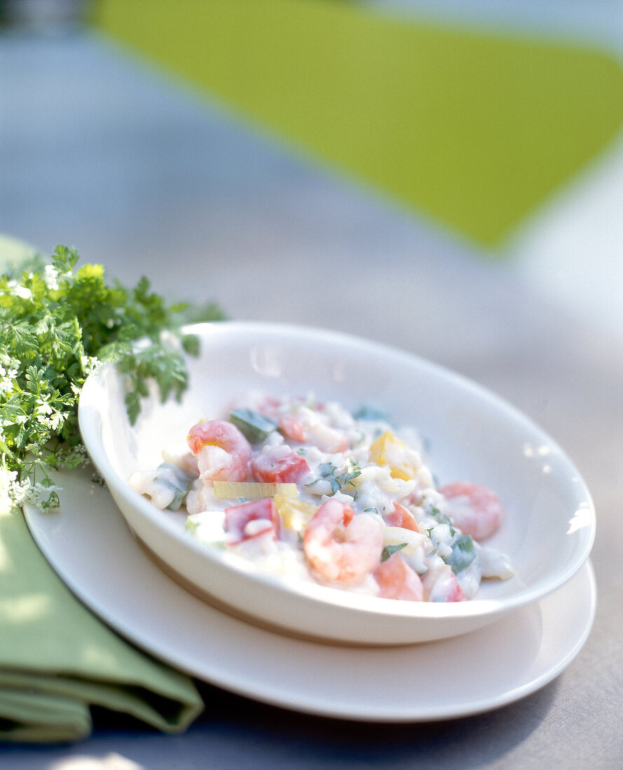 Pepper risotto with shrimp in bowl