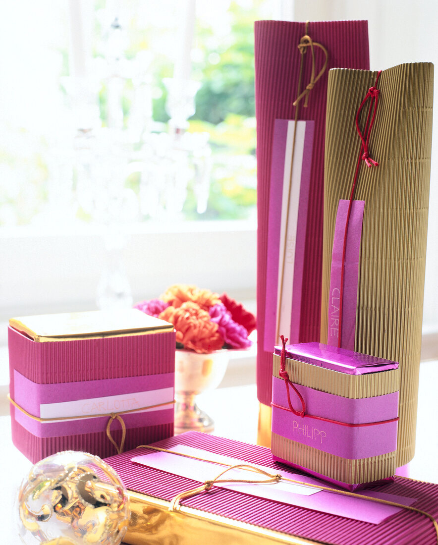 Gifts wrapped in glossy paper on corrugated board