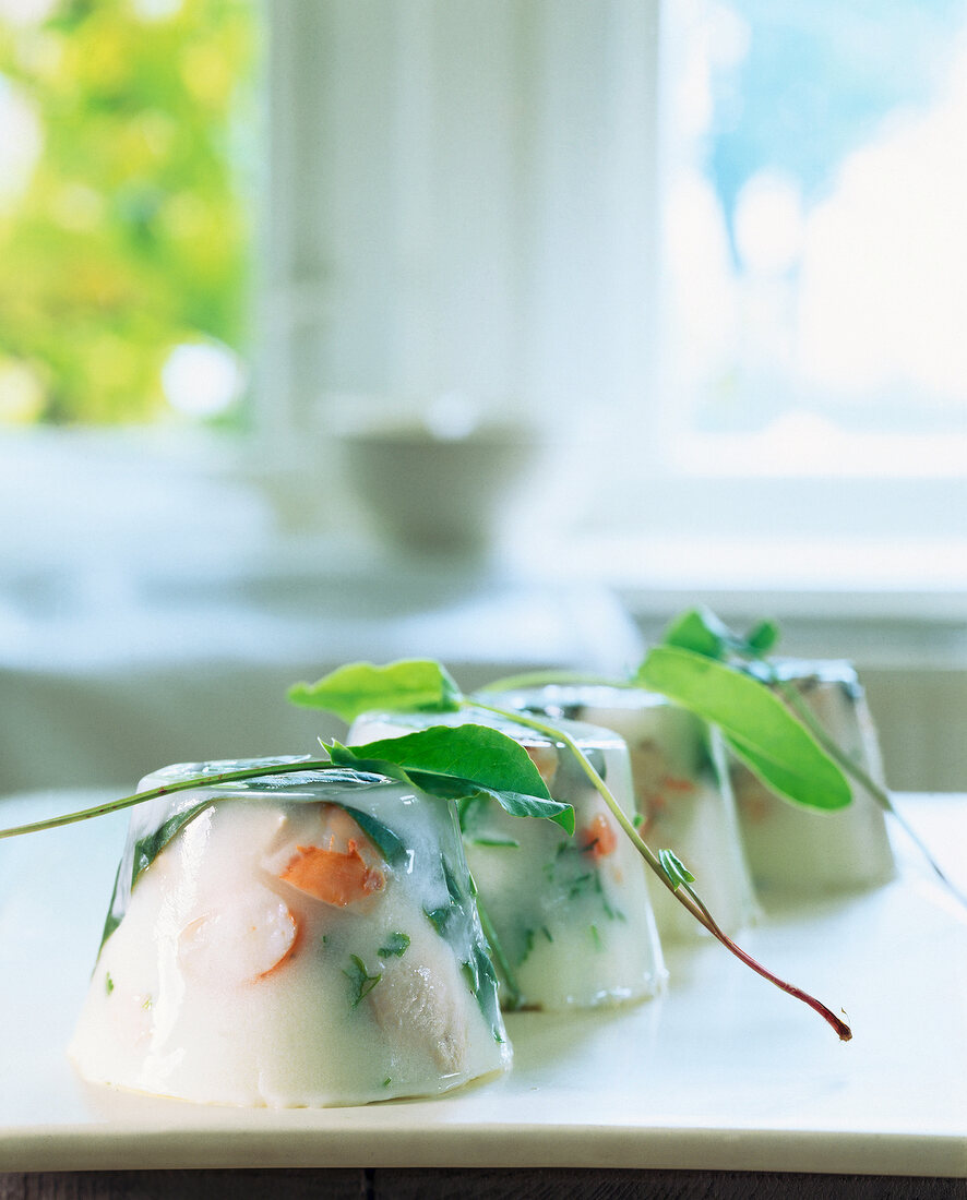 Close-up of wine and cream jelly with chicken and prawns