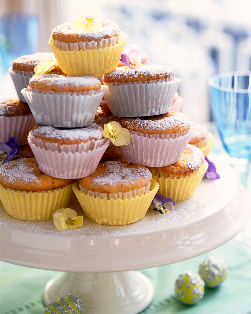 Stack of vanilla muffins on cake stand