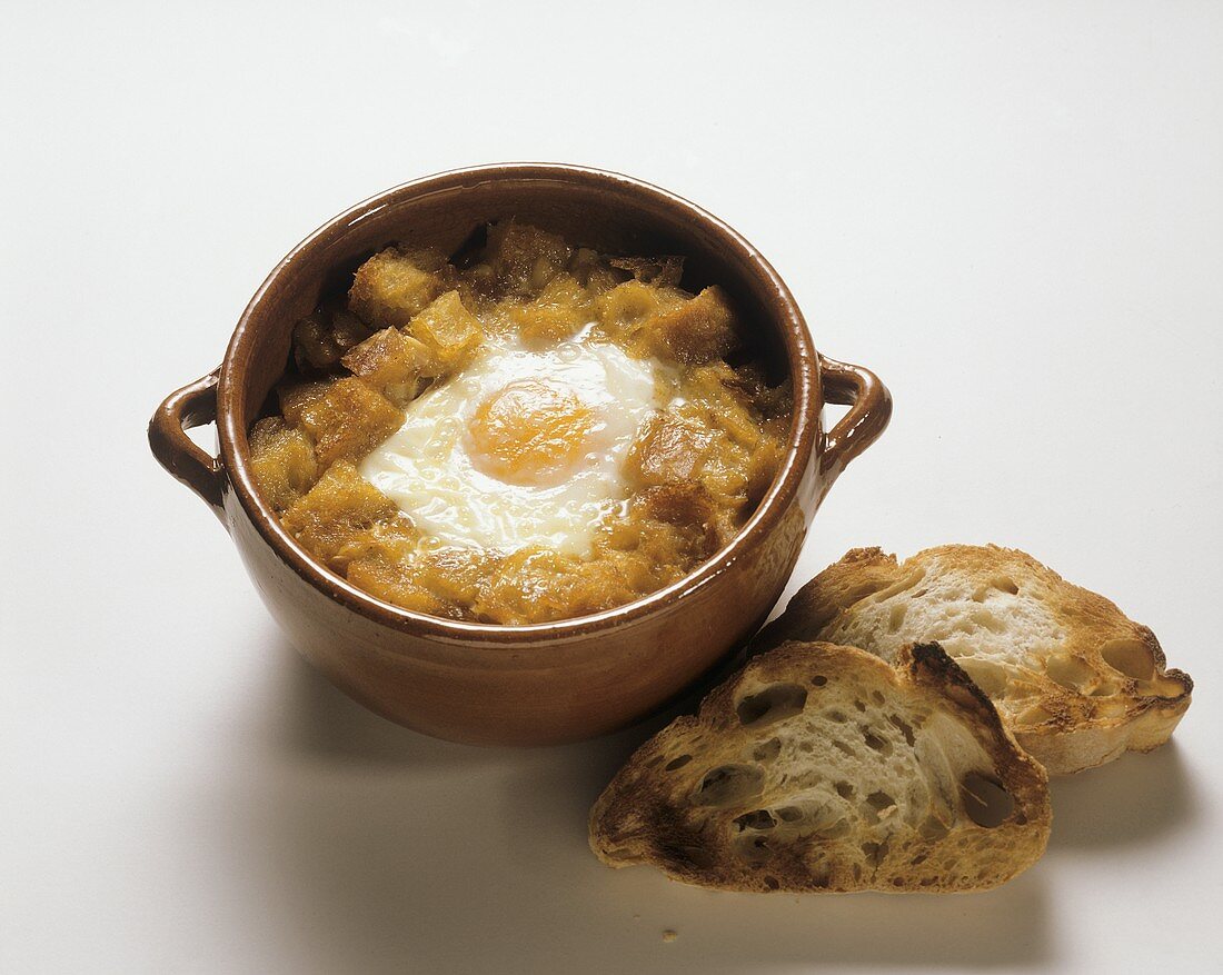 Garlic soup with croutons and fried egg