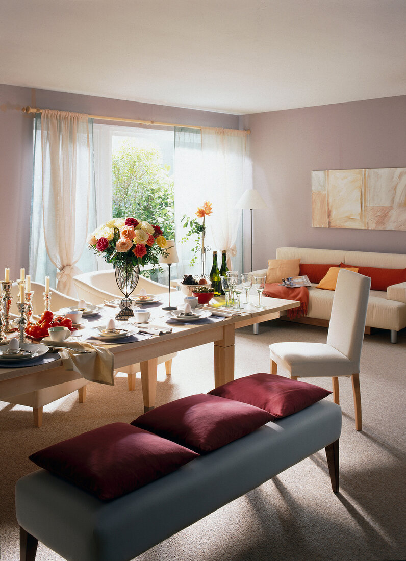 Living room and dining room in one room with cushions on bench seat