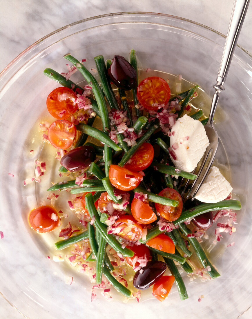 Close-up of bean and tomato salad with onion dressing