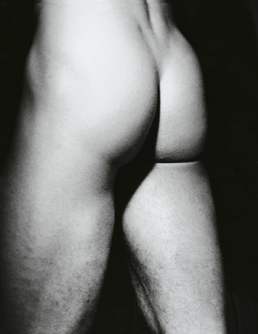 Close-up of buttocks and thighs of a man, black and white