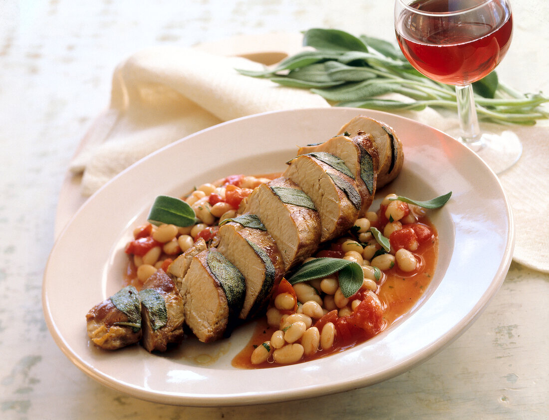 Tuscan pork fillets on plate served with red wine