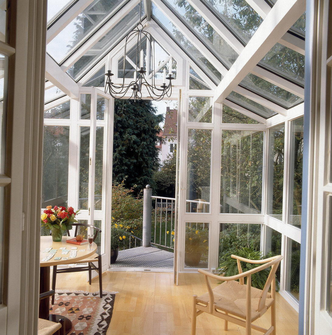 Interior of greenhouse with door and stairs to the garden