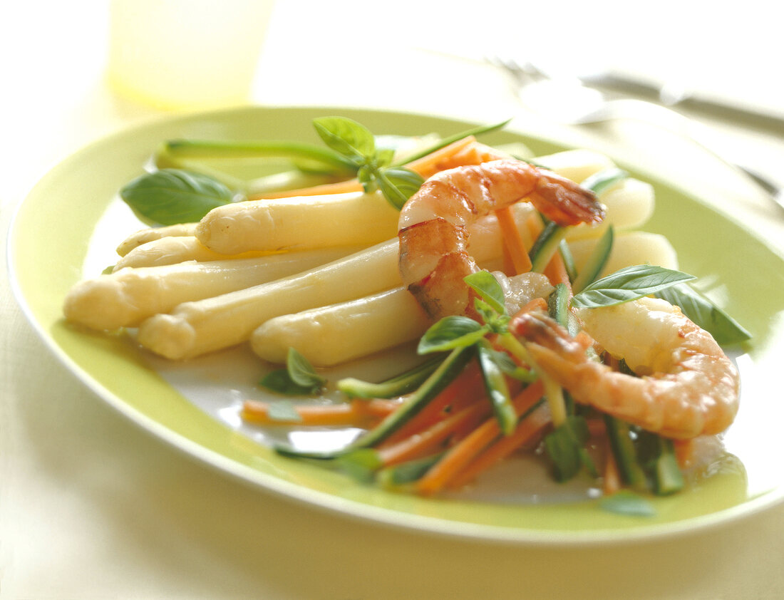 Asparagus with basil shrimp on plate