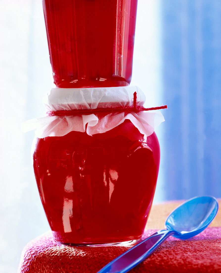 Close-up of piled apple currant jelly in glass containers