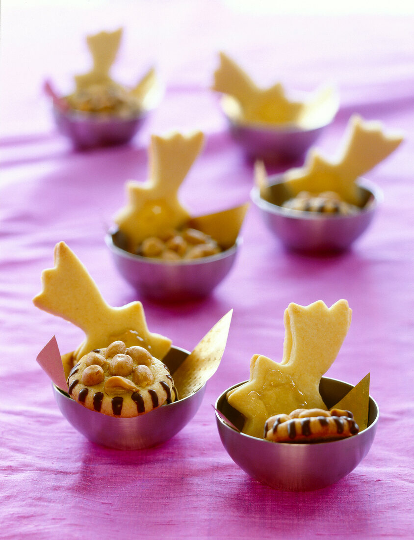 Star shaped peanut butter cookies in small pink bowl