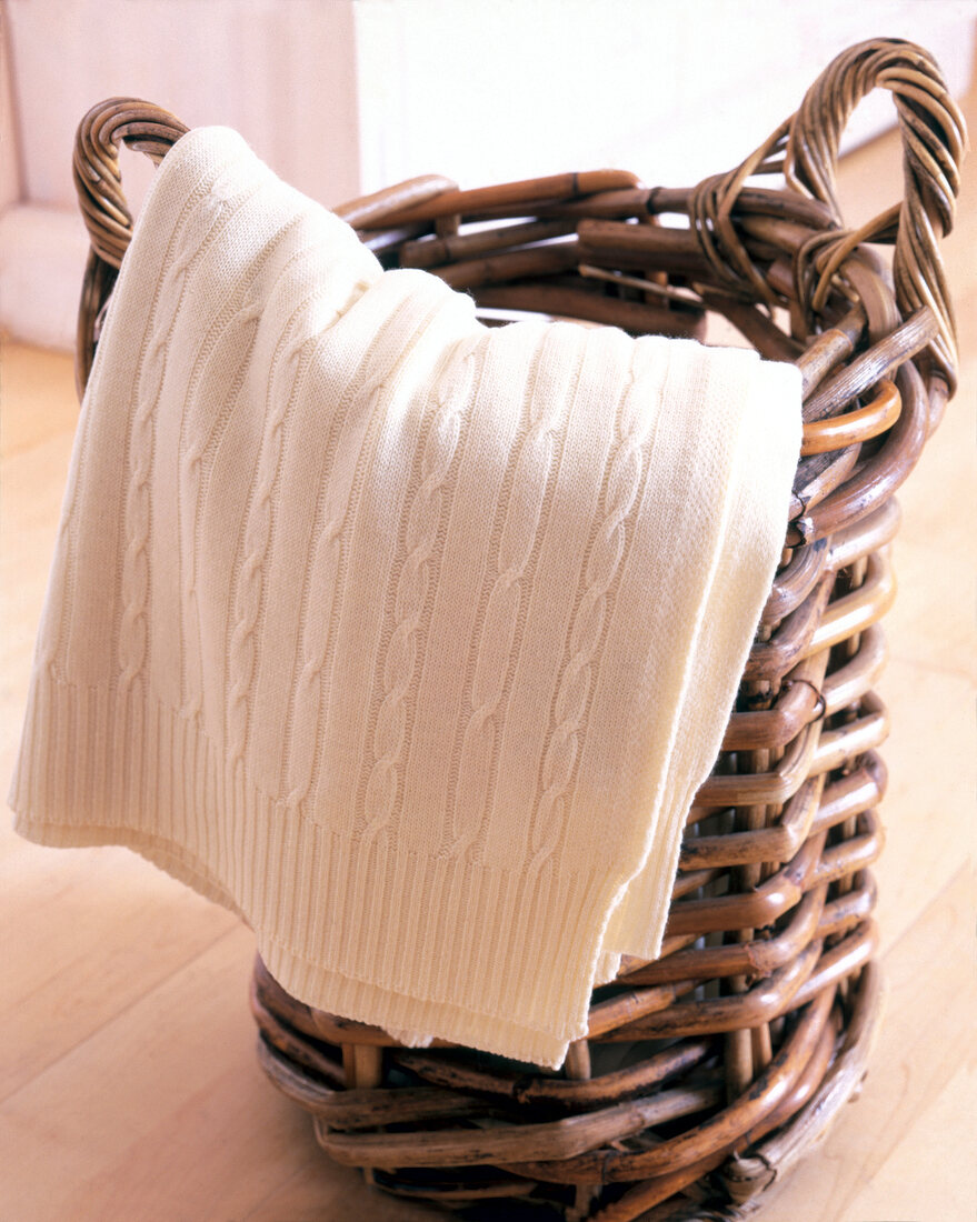 Close-up of wicker basket with sweater