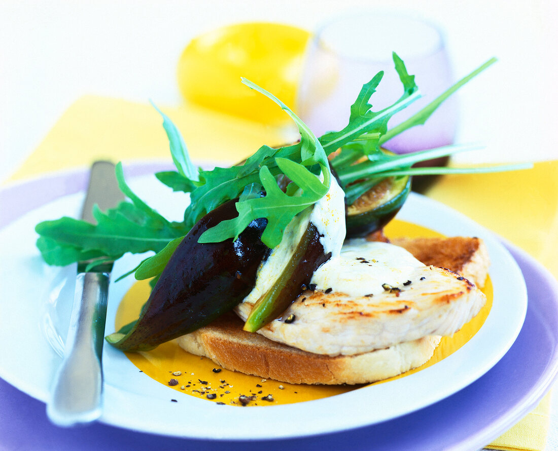 Toast with turkey breast and figs on plate