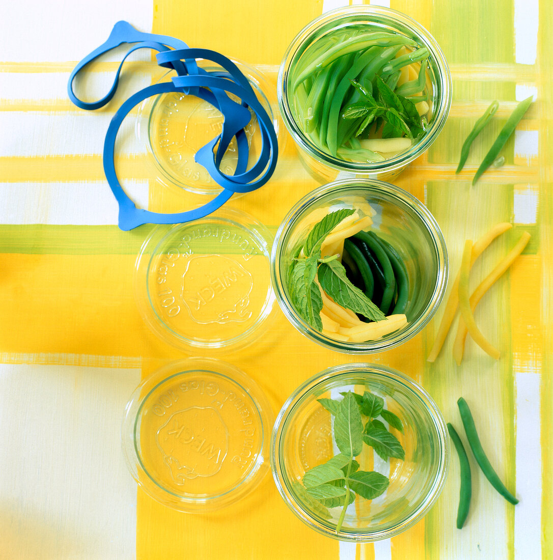 Close-up of three glasses with mixed beans and mint