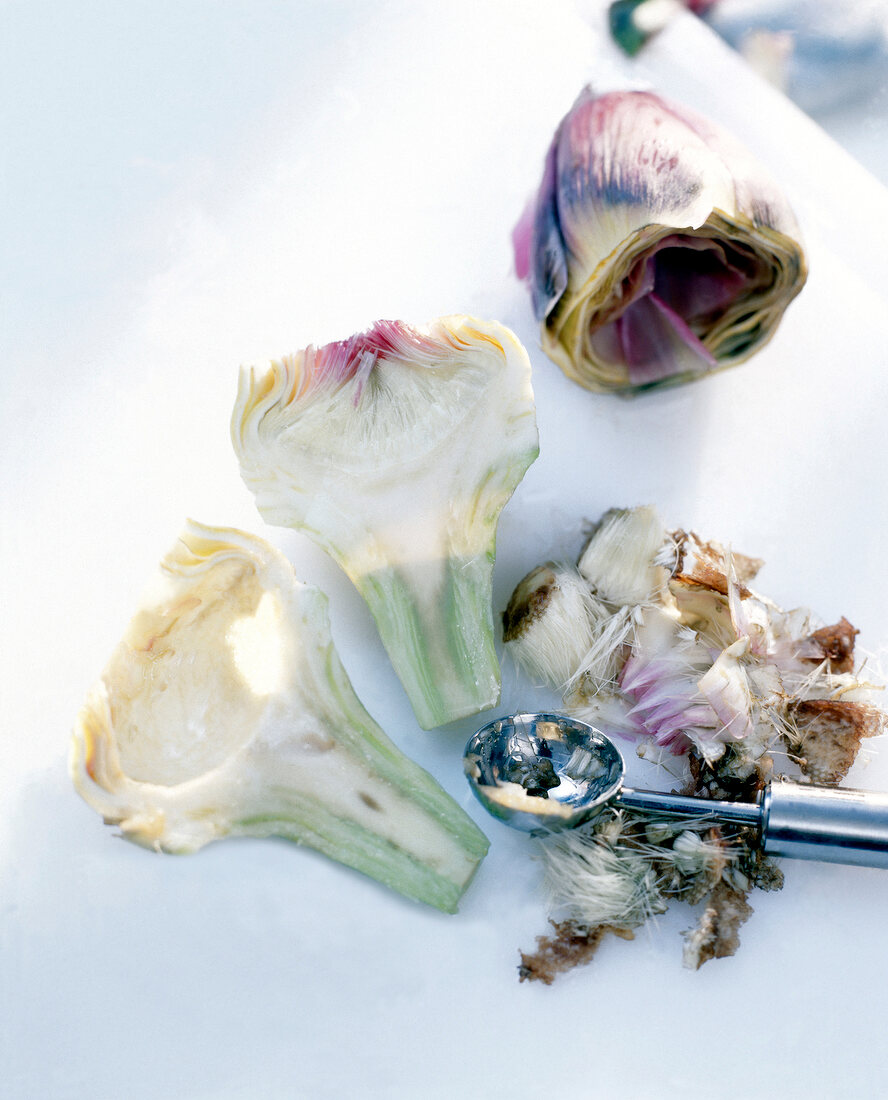 Artichokes cut into halves and hollowed on table