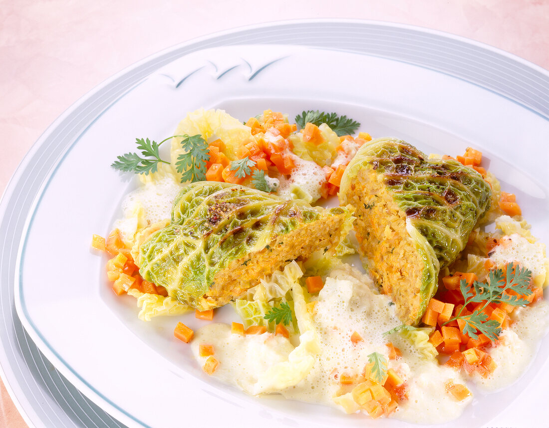 Savoy cabbage rolls with chopped carrots and gruenkern filling