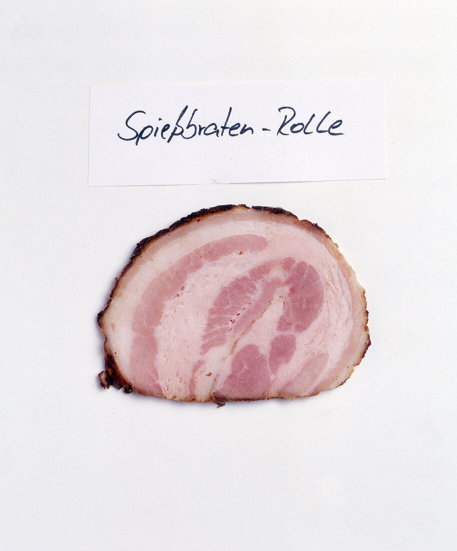 Slice of spiessbraten on white background