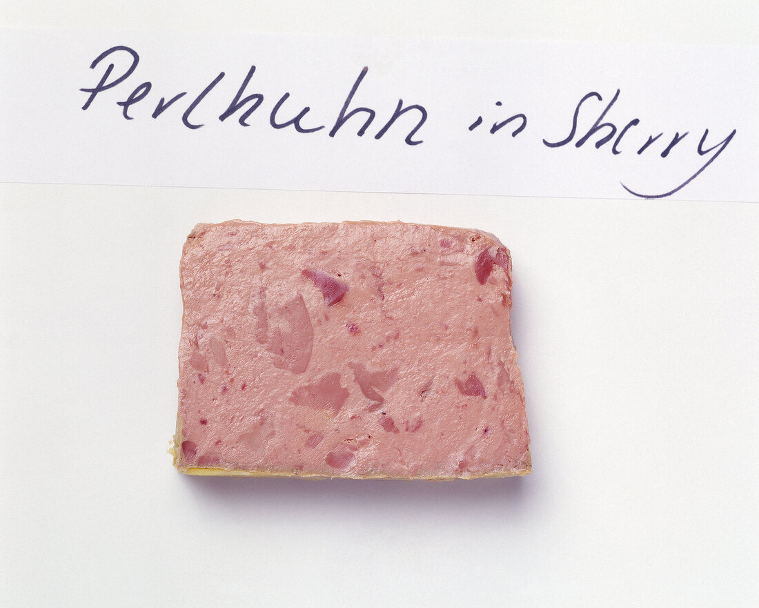 Slice of guineafowl pate in sherry