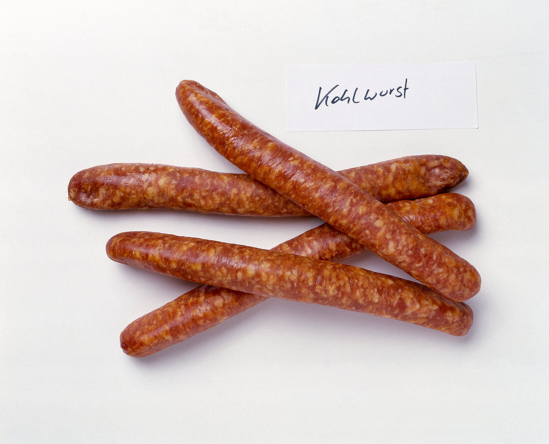 Cabbage sausages on white background