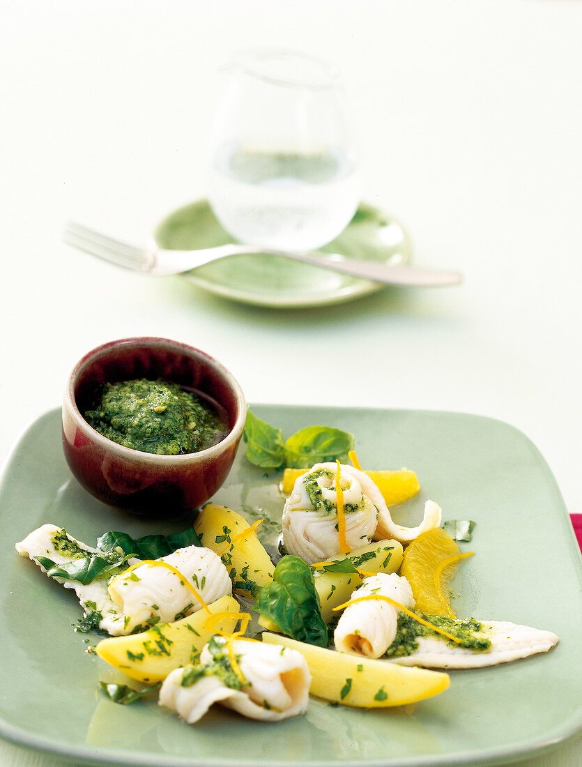 Sole rolls with pesto on square plate