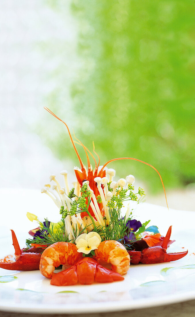 Close-up of crayfish with wasabi sauce on white plate