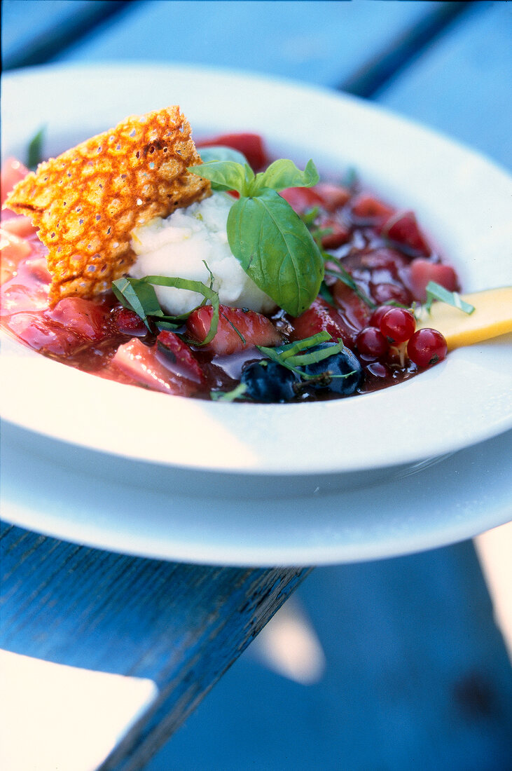 Close-up of strawberry soup with lemon sorbet on plate