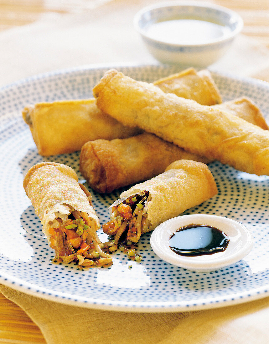 Spring rolls and dip served on plate