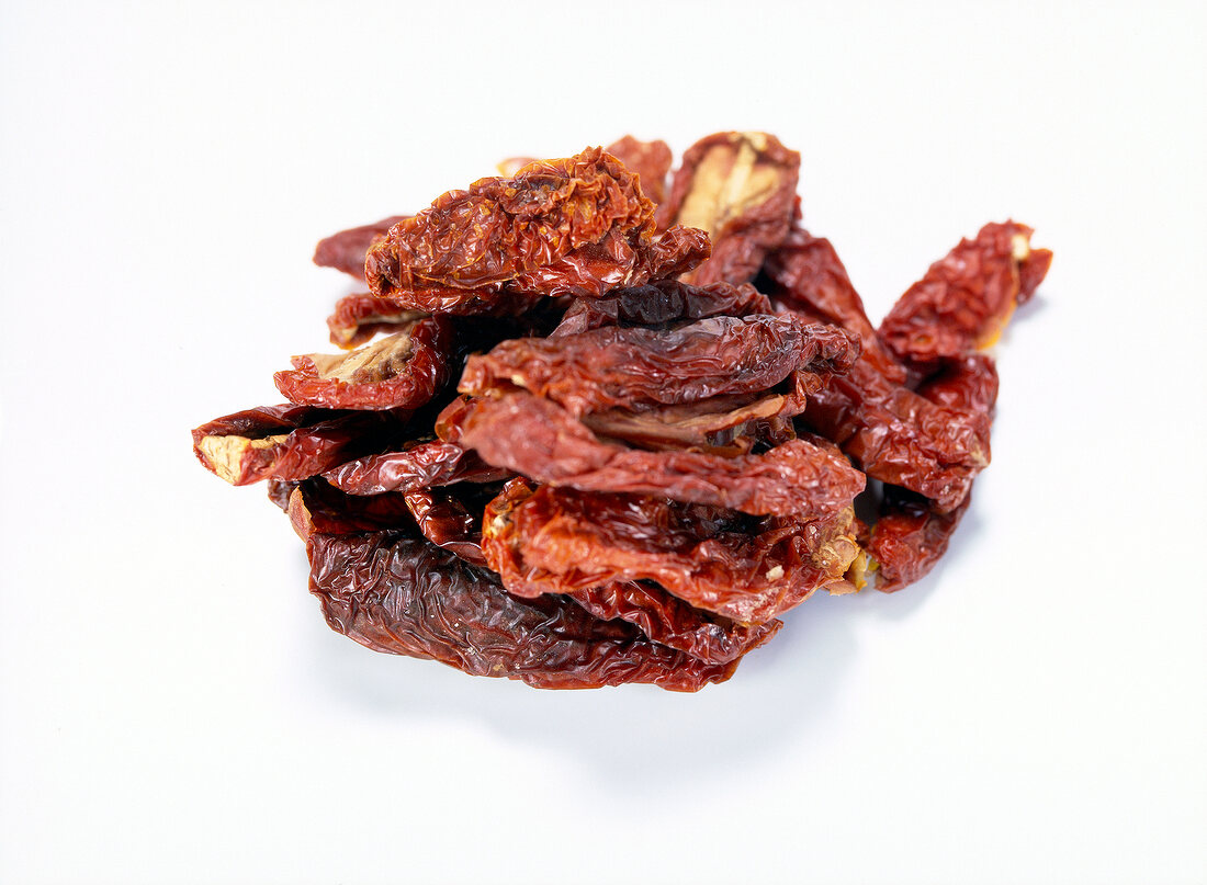 Dried tomatoes on white background