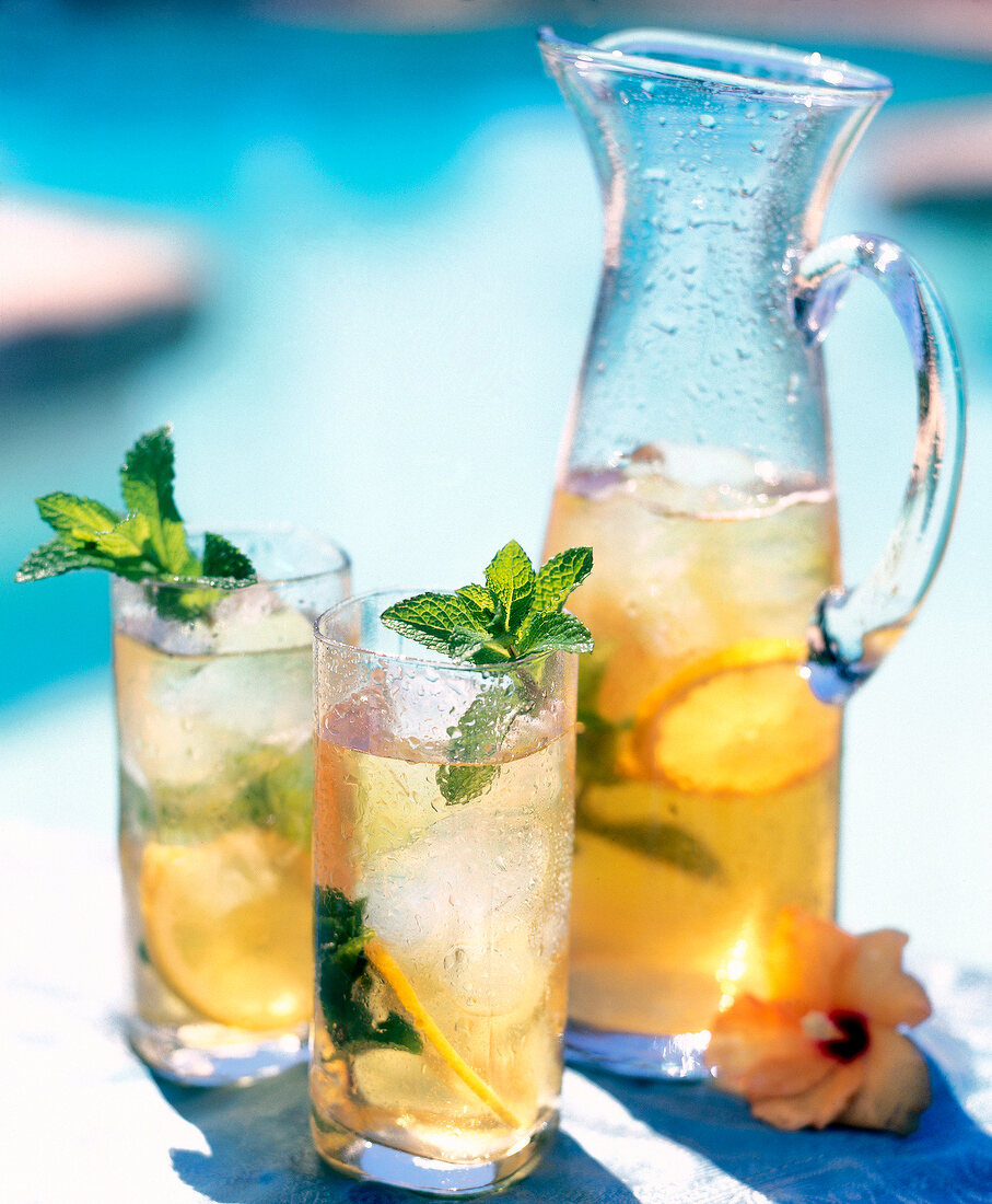 Lime ice mint tea in carafe and glasses