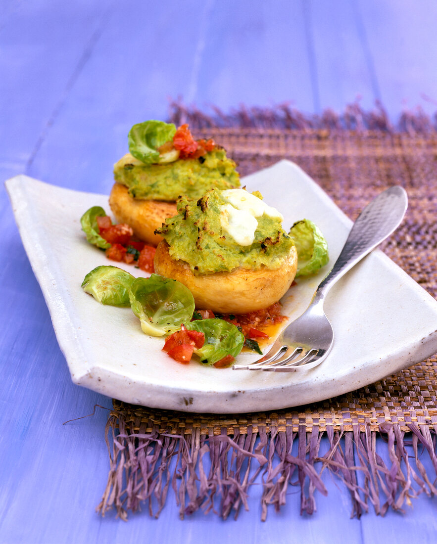 Stuffed mushrooms with rosenkohl puree on square plate