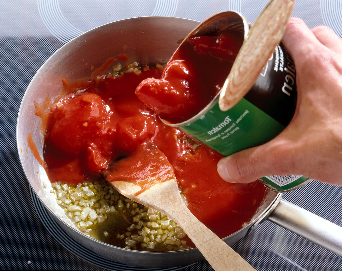 Tomato sauce cooking in saucepan