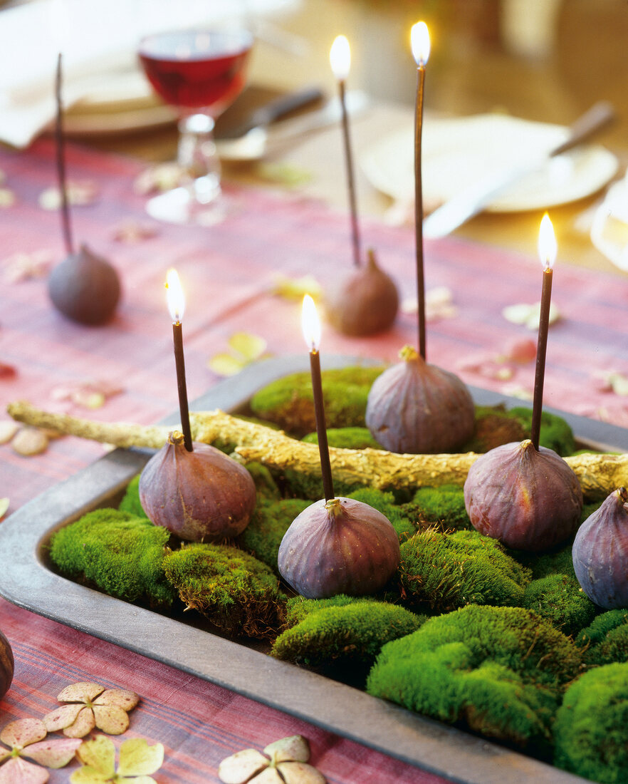 Figs with lighted candle in tray - Thanksgiving decoration