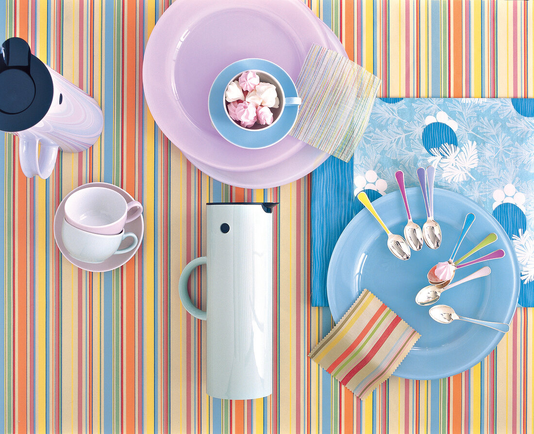Dishes with capri-style in pastels on striped fabric