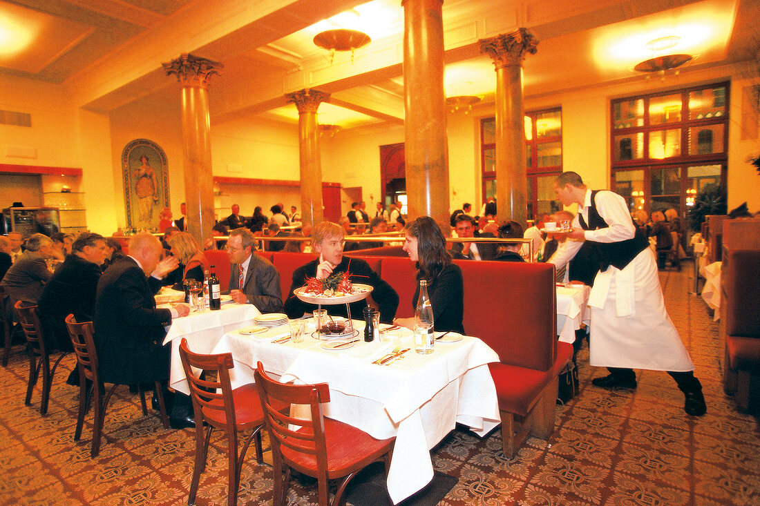 People dining at Borchardt Restaurant in Berlin, Germany