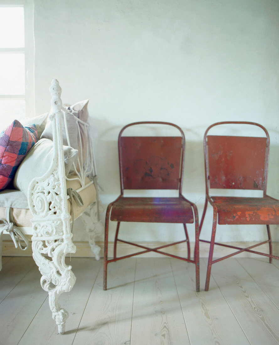 Iron chairs with rusty stains in bedroom