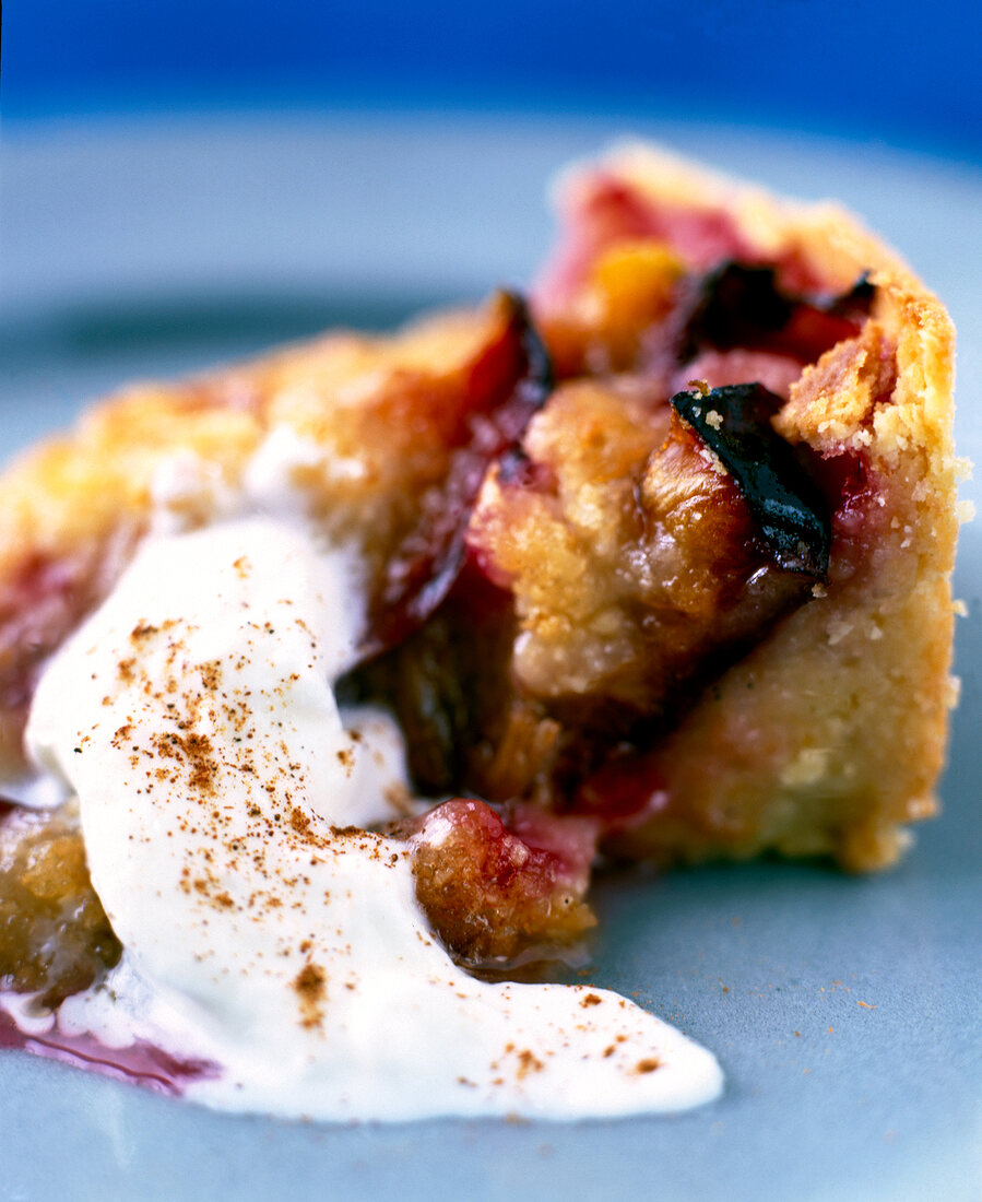 Close-up of cream filled plum cake