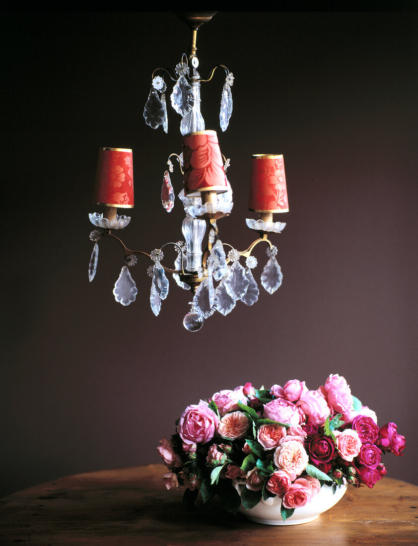 Crystal chandelier and different flowers in pot