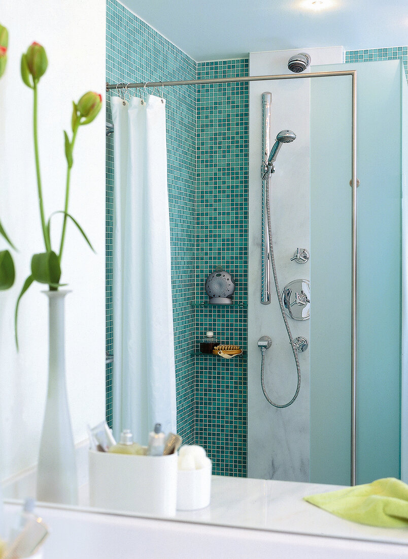 Bathroom with blue mosaic tiles, shower and marble panel
