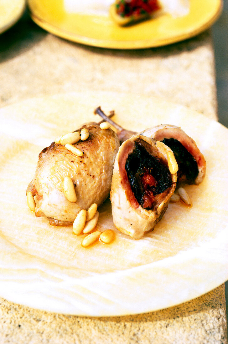 Close-up of quail with dates and Sobrassada on plate, Tapas