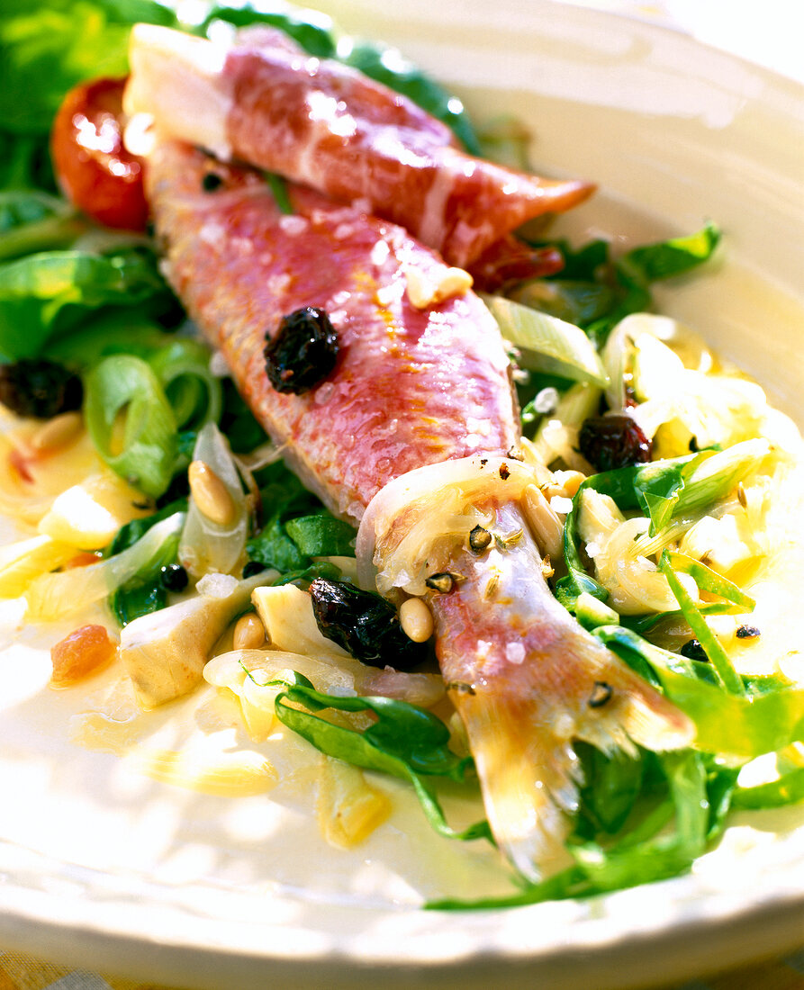 Close-up of red mullet with serrano ham salad
