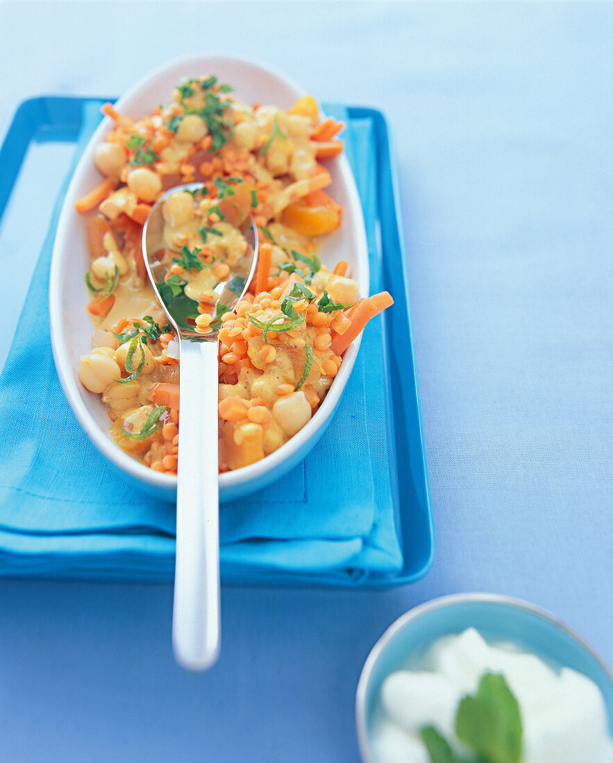 Close-up of veg lentil curry with coconut in bowl