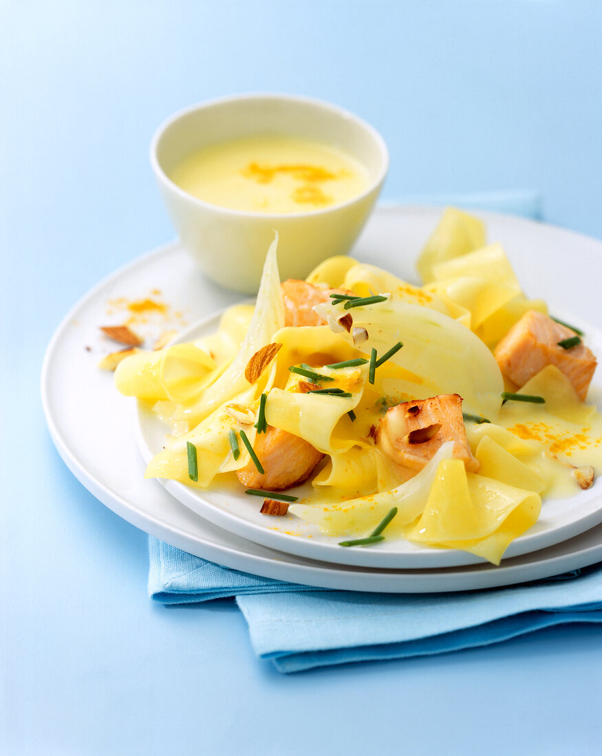 Close-up of fettuccine with salmon coconut sauce on plate