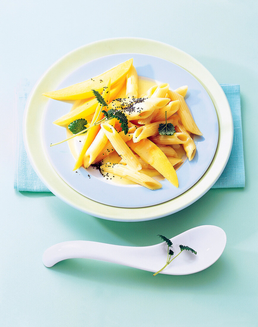 Close-up of sweet mango penne on plate