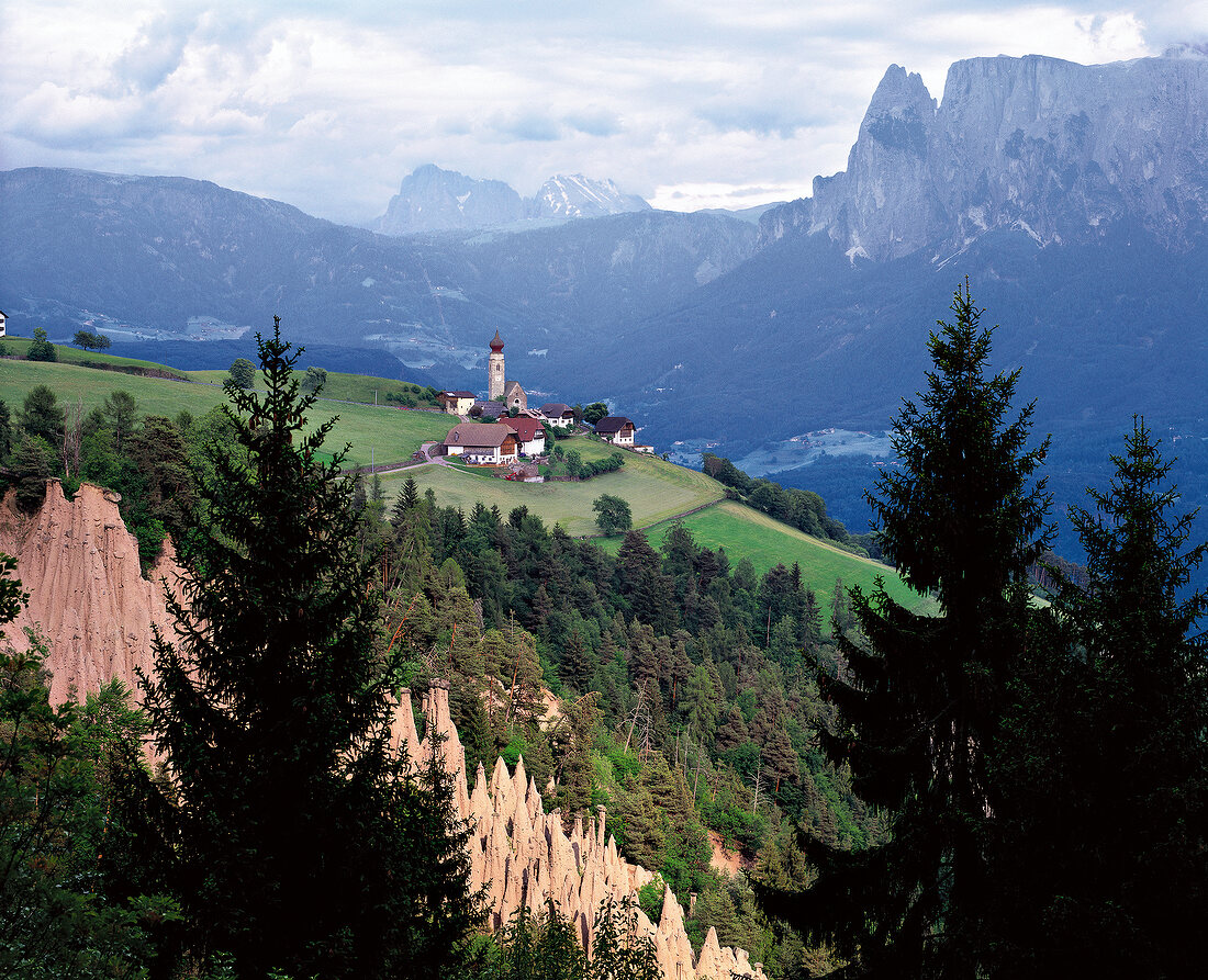 View of Alpine landscape and the Sarn Valley with village church in South Tyrol, Italy