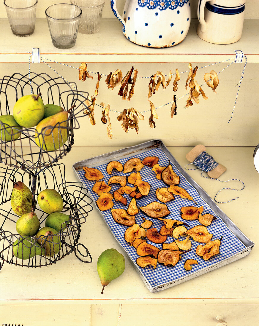 Dried pears on tray and dried mushroom on leash