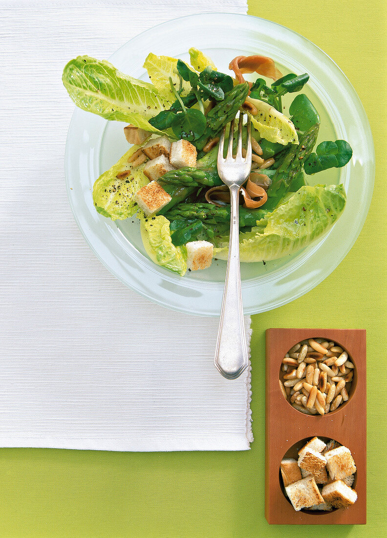 Watercress salad on plate, overhead view